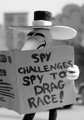 The Black Spy from Mad Magazine reads a headline: Spy Challenges Spy to Drag
                Race!