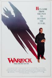 A neatly dressed, barefooted Julian Sands (as the Warlock) casts a demonic
                shadow.