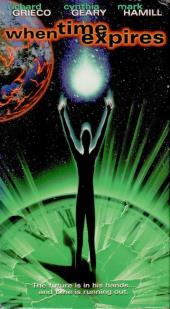 A tall, skinny silhouette of a person stands on a radiating, green clock with
                his arms raised to a comet and an electrified Earth.