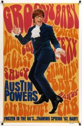In his signature blue suit, Mike Myers (as Austin Powers) does groovy dance
              moves in front of 60s pop-art slogans.