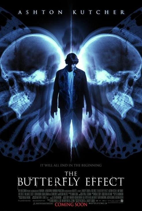 A downtrodden Ashton Kutcher (as Evan) stands between x-rays of two skulls superimposed on a giant monochrome butterfly.