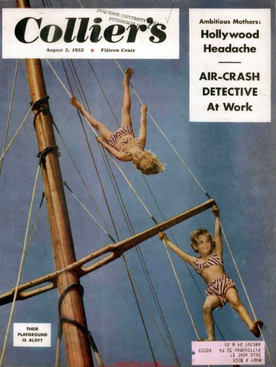 Color photo of young twin girls climbing high in the rigging of a ship’s mast.