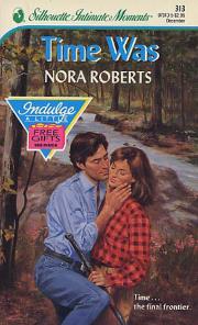 Standing by a creek in the woods, a dark-haired man draws a woman toward him
                for a kiss.