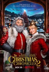 Kurt Russell (as Santa) and Goldie Hawn (as Mrs. Santa) pose in front of his
                village and two sleighs in the sky.