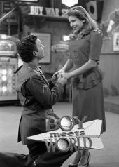 Down on one knee, Ben Savage (as Cory Matthews in a World War 2 uniform)
                proposes to Danielle Fishel (as Topenga in a 1940s dress).