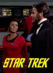 Nichelle Nichols [as Uhura] and Lee Bergere [as Lincoln] converse on the bridge
                of the Enterprise.